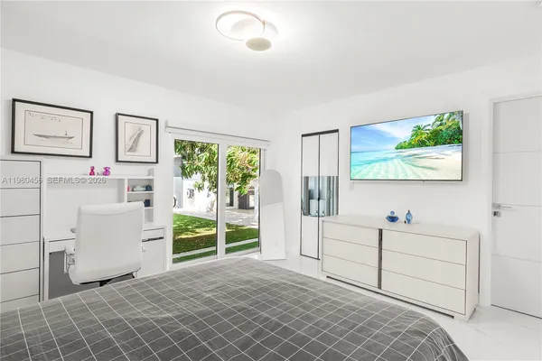 a room with a baby crib and a window