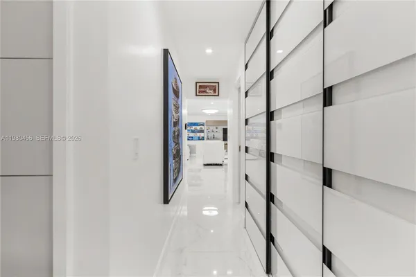 a bedroom with a large bed and a flat screen tv