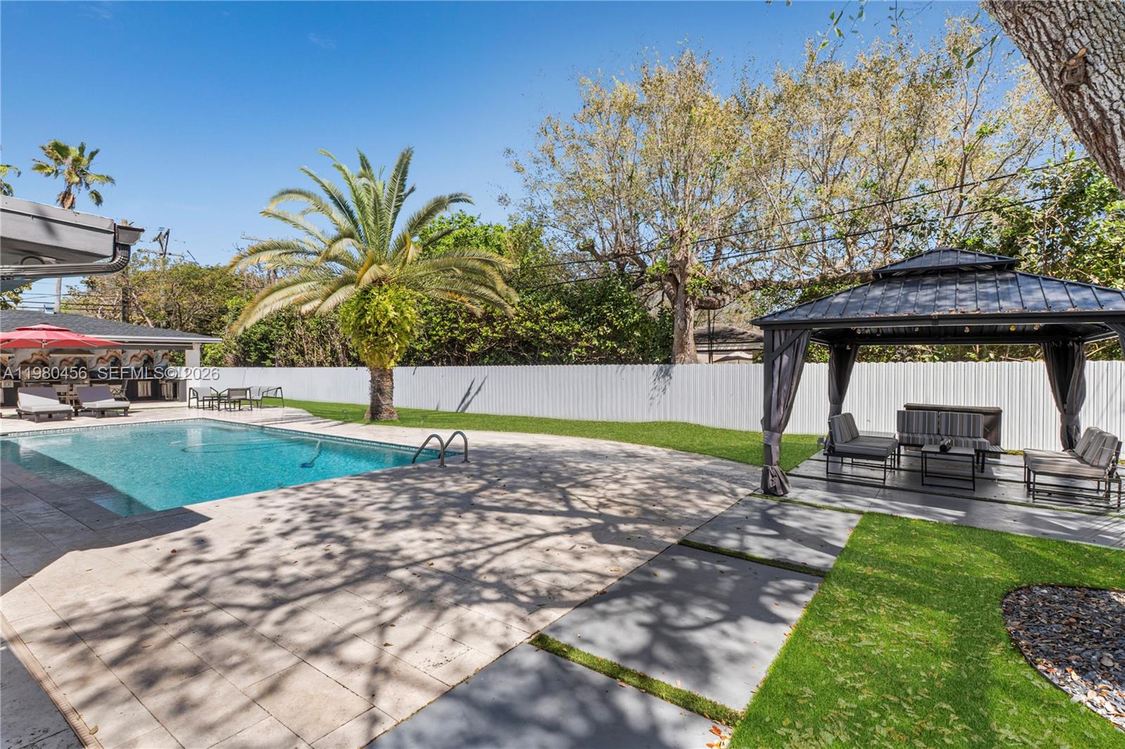12401 Southwest 72nd Avenue Pinecrest, FL 33156 - Photo 22 of 35 a view of a backyard with a garden