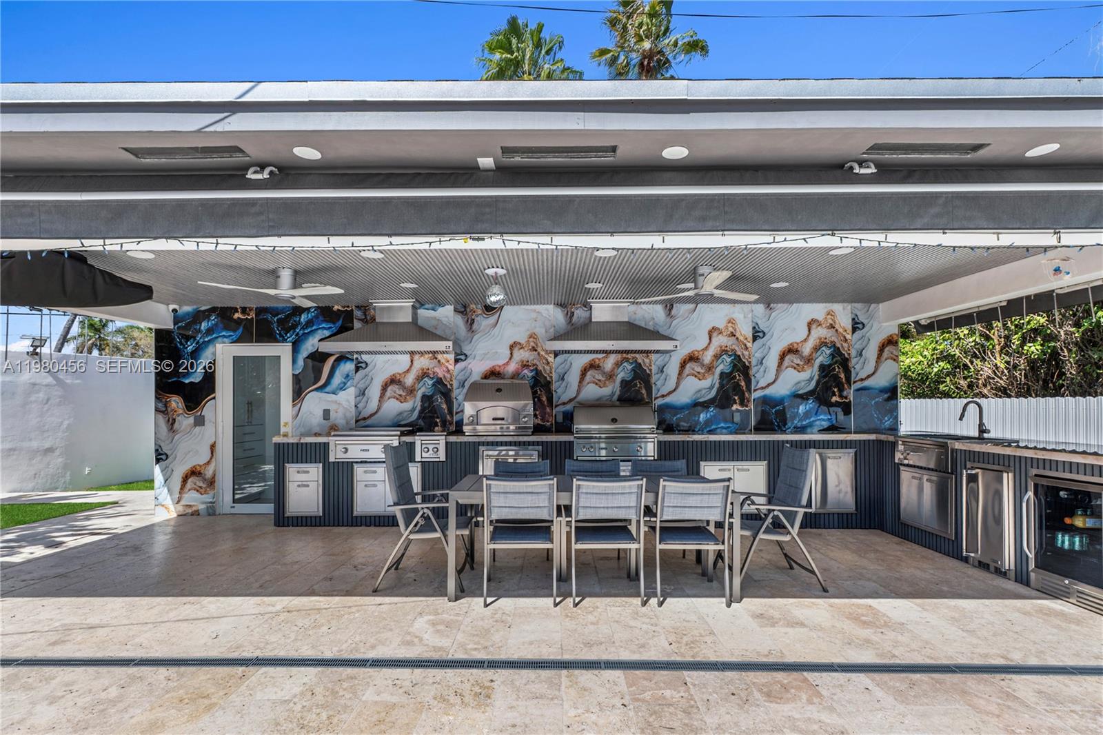 12401 Southwest 72nd Avenue Pinecrest, FL 33156 - Photo 25 of 35 a view of a chairs and table in a patio