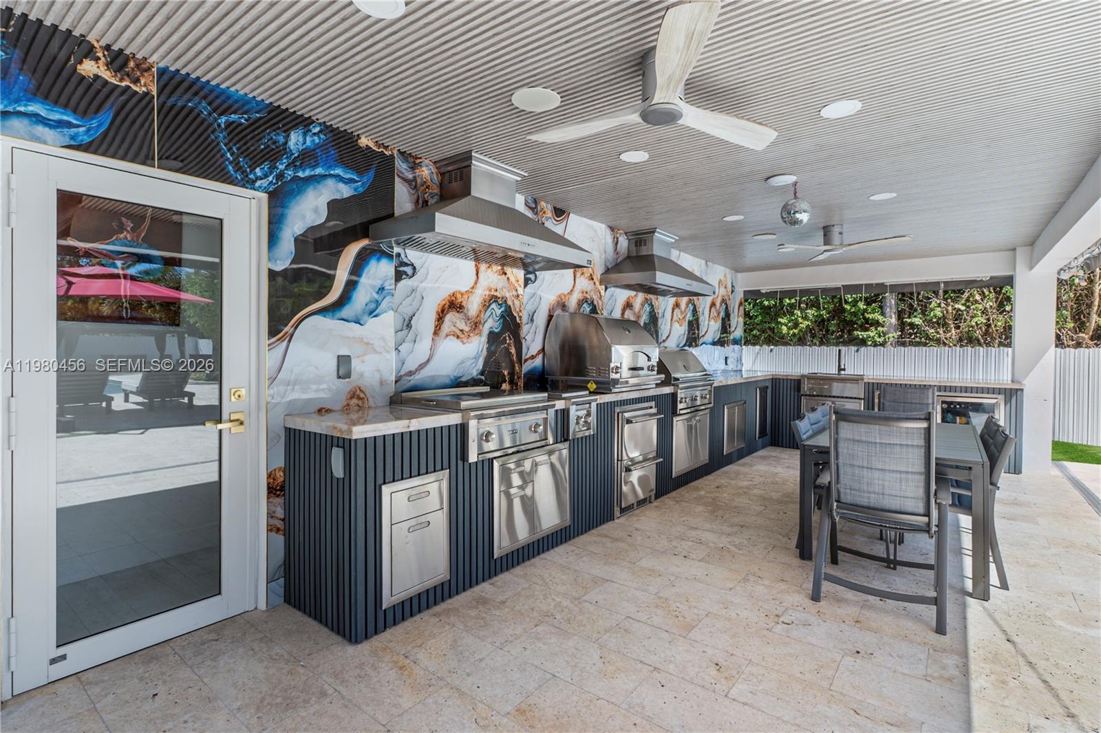 12401 Southwest 72nd Avenue Pinecrest, FL 33156 - Photo 26 of 35 a kitchen with stainless steel appliances granite countertop lots of counter top space