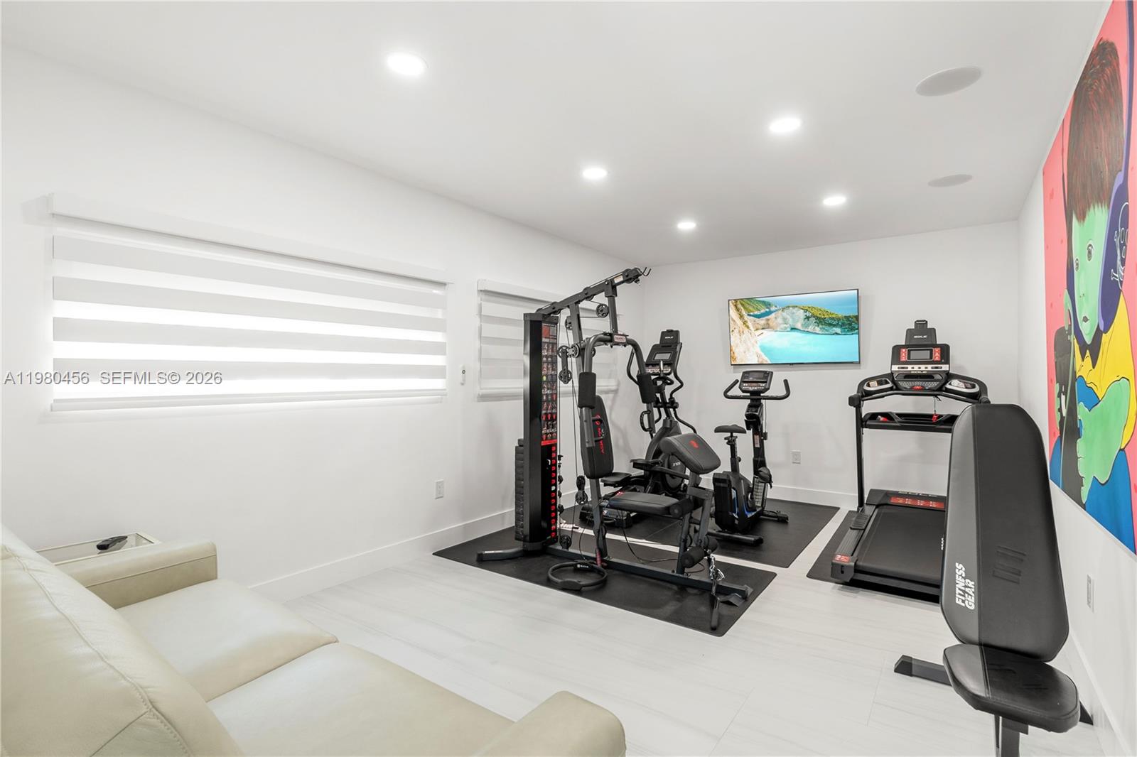 12401 Southwest 72nd Avenue Pinecrest, FL 33156 - Photo 28 of 35 a view of a room with gym equipment