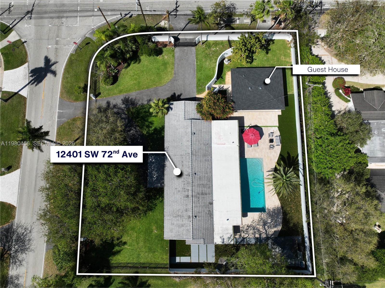 12401 Southwest 72nd Avenue Pinecrest, FL 33156 - Photo 35 of 35 an aerial view of a house with a yard and a large tree