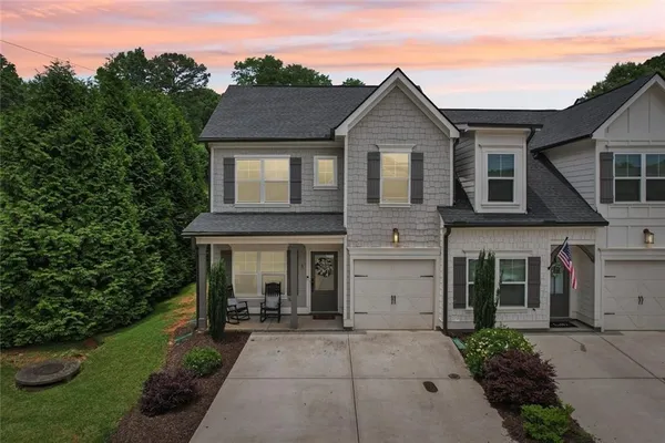 a front view of a house with a yard