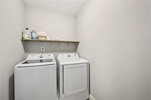 a spacious bathroom with a double vanity sink and a mirror