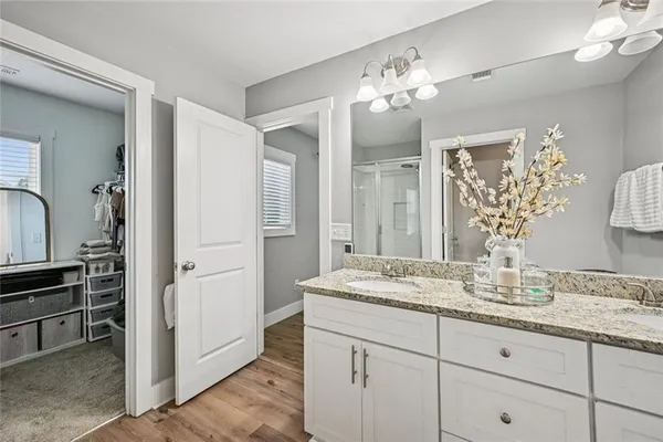 a bathroom with a glass shower door