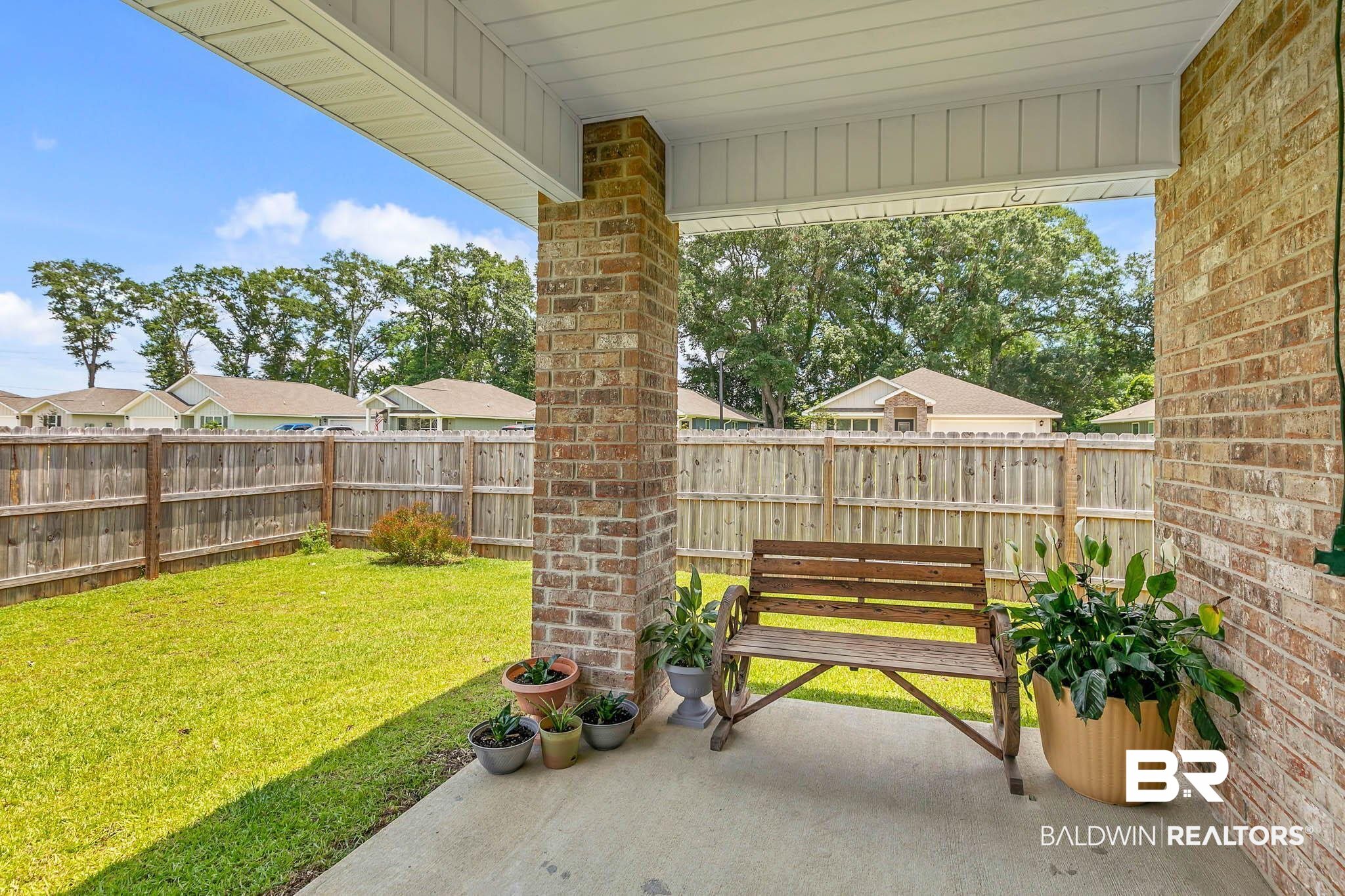 17217 REFLECTION Street Loxley, AL 36551 - Photo 41 of 83 Fenced backyard with a patio