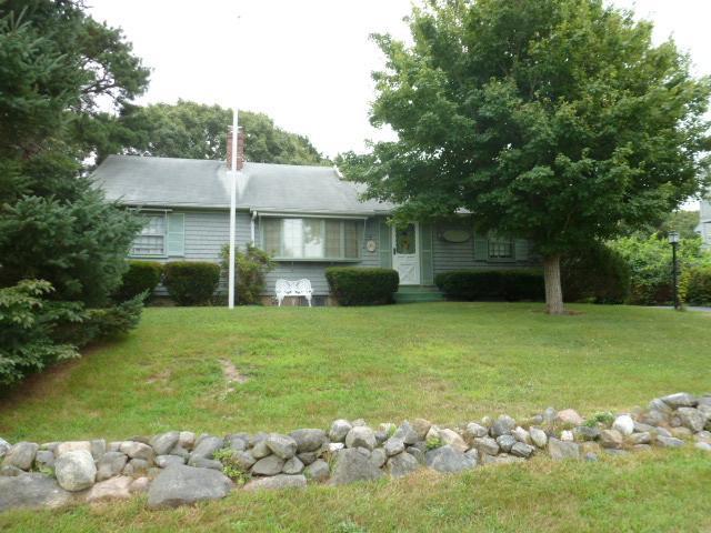 14 Captain Wing Road East Sandwich, MA 02537 - Photo 3 of 20 a front view of a house with garden