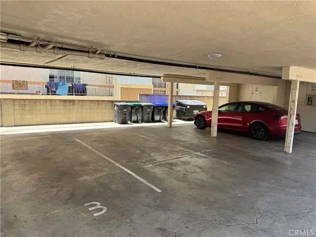 a view of parking garage with cars parked