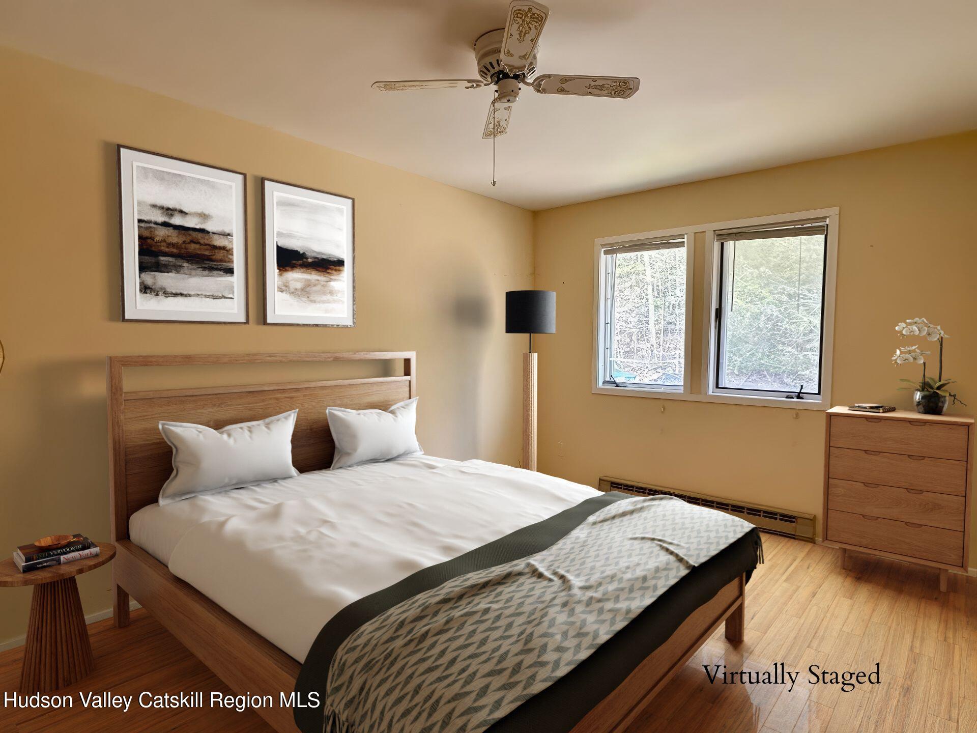 260 Pines Drive, Unit 82 Roxbury, NY 12421 - Photo 17 of 31 a bedroom with a bed and a window