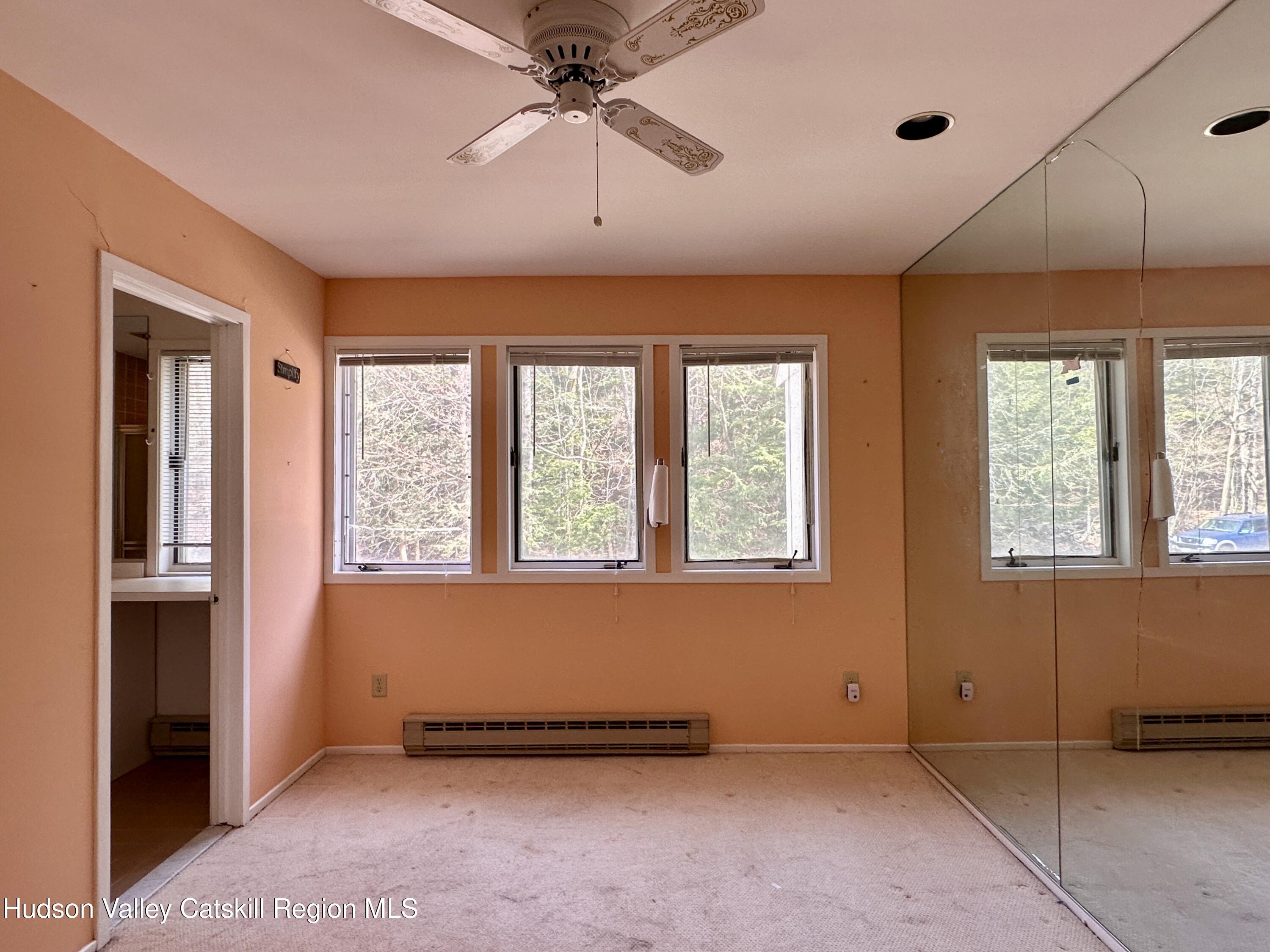260 Pines Drive, Unit 82 Roxbury, NY 12421 - Photo 20 of 31 a view of an empty room with a window