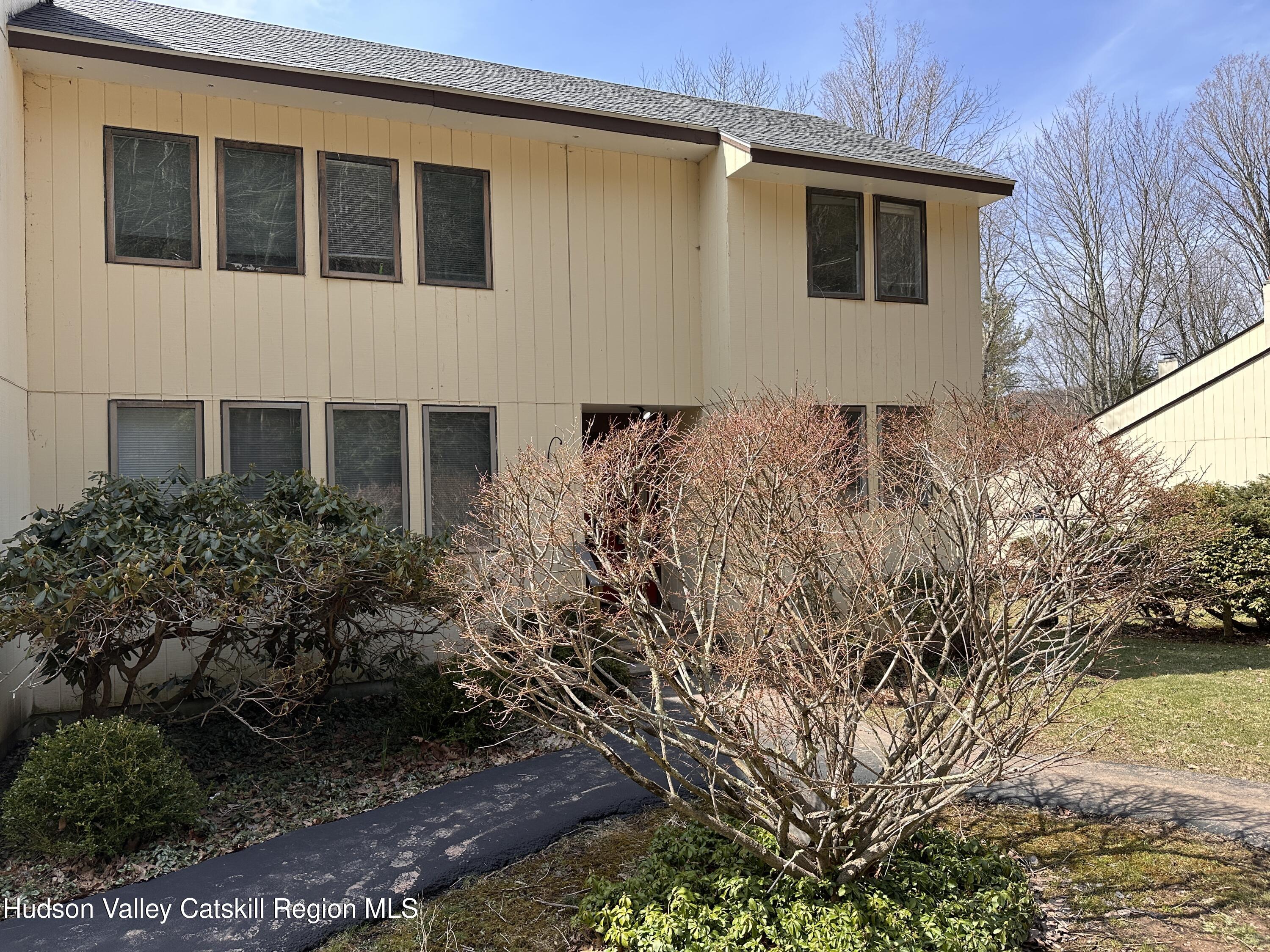260 Pines Drive, Unit 82 Roxbury, NY 12421 - Photo 2 of 31 a house with trees in front of it