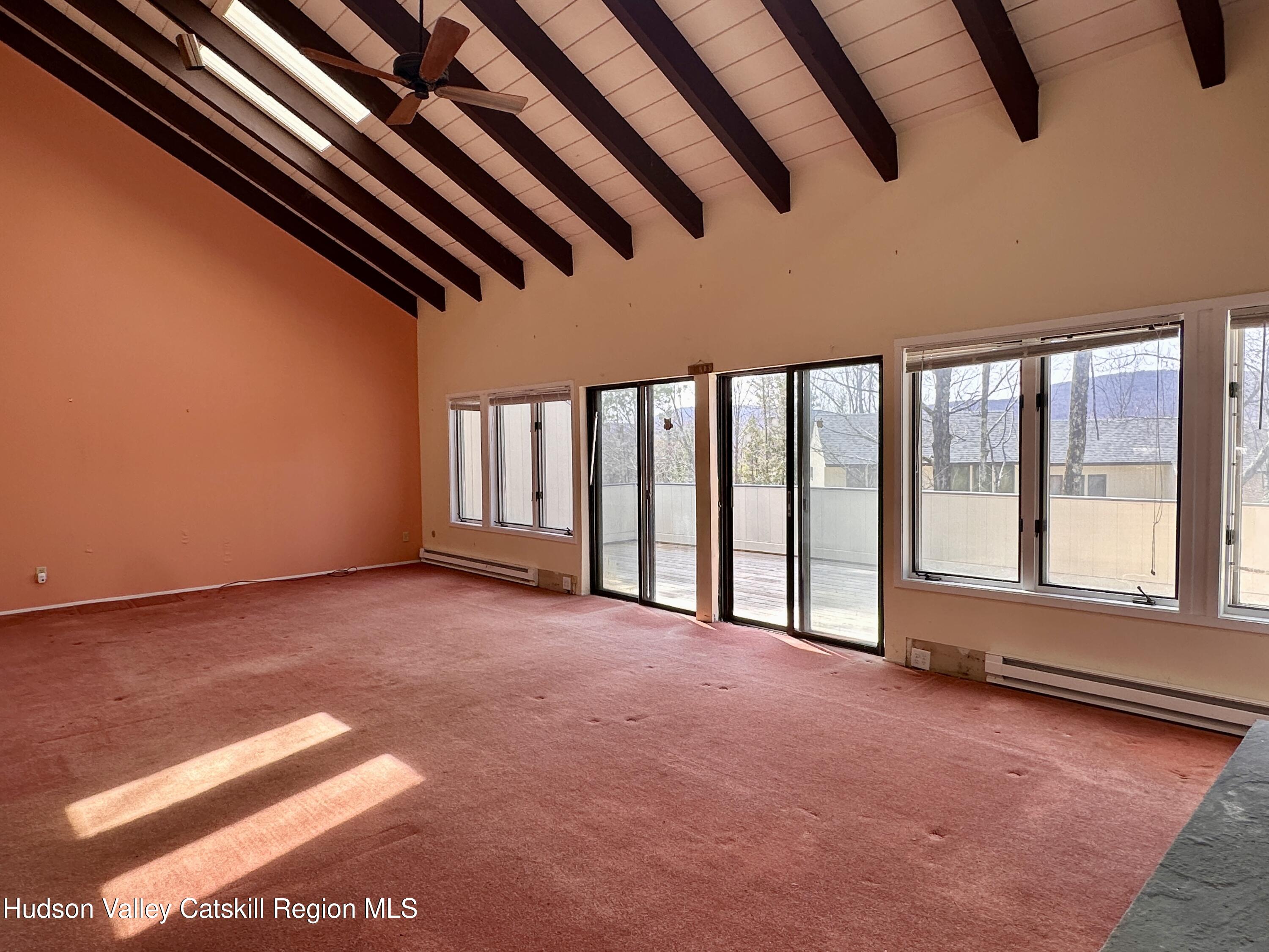 260 Pines Drive, Unit 82 Roxbury, NY 12421 - Photo 9 of 31 a view of an empty room with a window