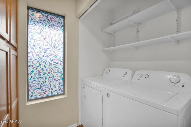 a utility room with dryer and washer