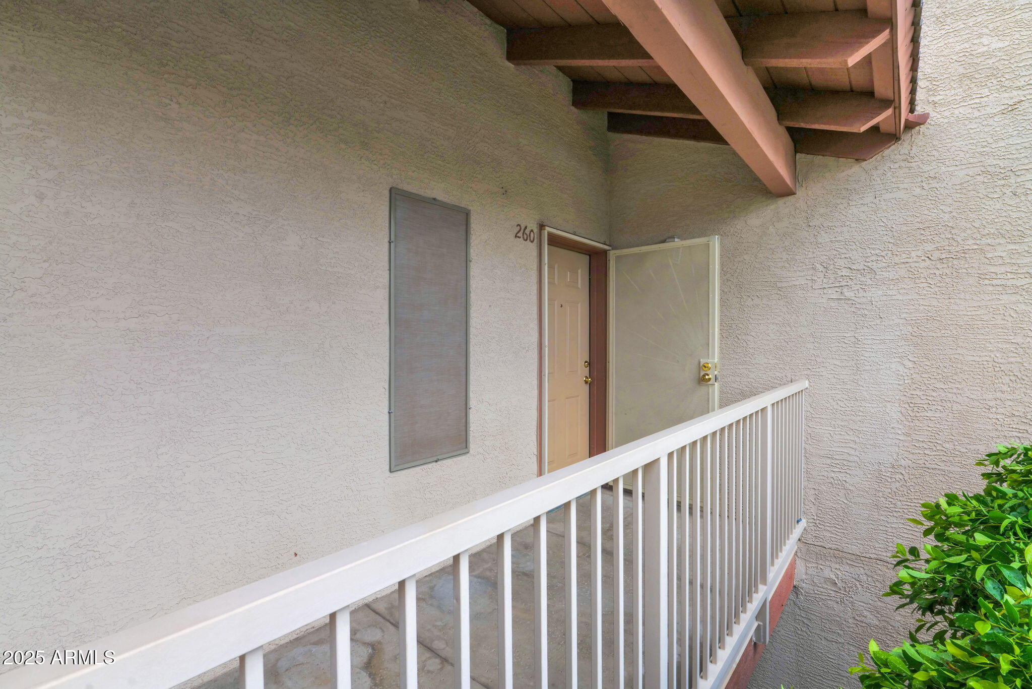 205 North 74th Street, Unit 260 Mesa, AZ 85207 - Photo 29 of 37 a view of staircase with railing and white walls