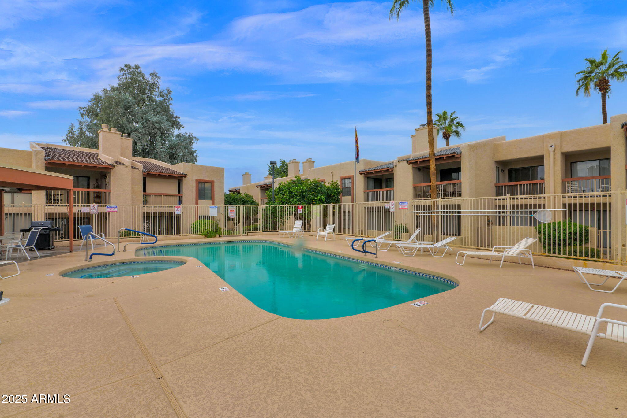 205 North 74th Street, Unit 260 Mesa, AZ 85207 - Photo 31 of 37 a view of a swimming pool with a patio