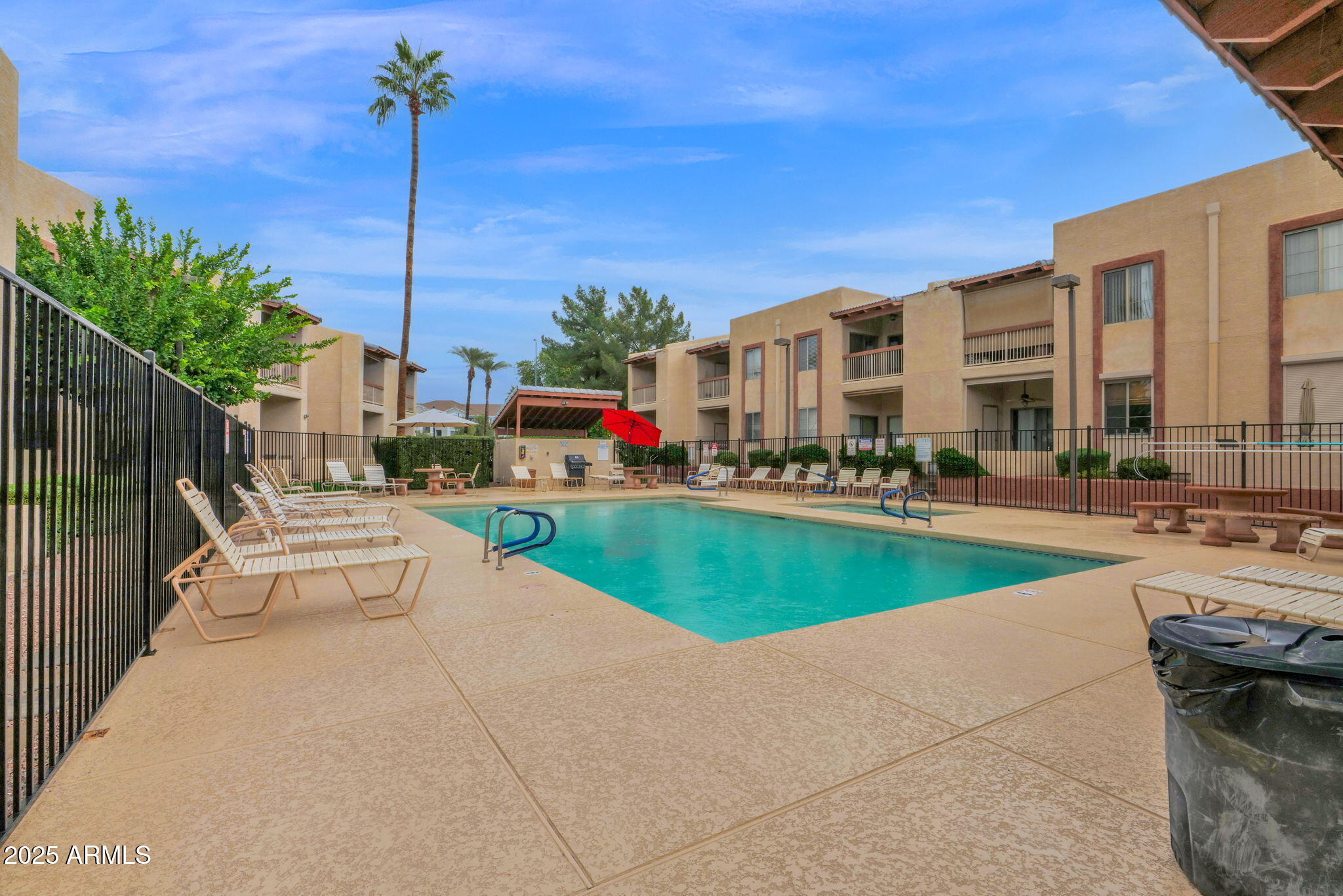 205 North 74th Street, Unit 260 Mesa, AZ 85207 - Photo 34 of 37 a view of a patio with a table and chairs