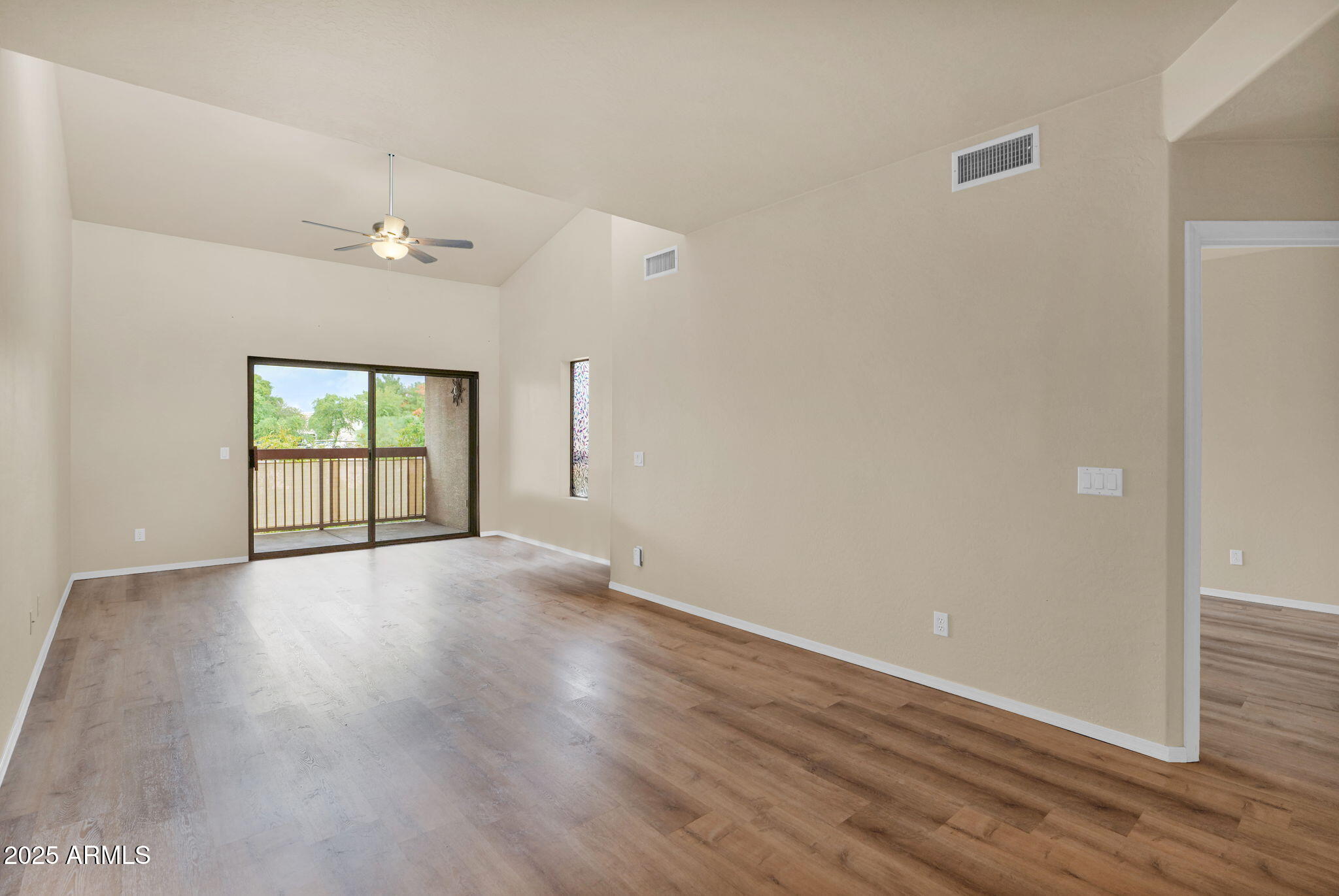 205 North 74th Street, Unit 260 Mesa, AZ 85207 - Photo 9 of 37 wooden floor in an empty room with a window