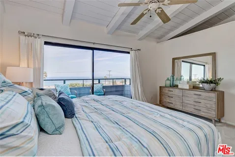 a bed room with a bed and a dresser