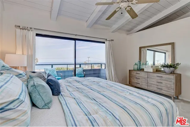 a bed room with a bed and a dresser