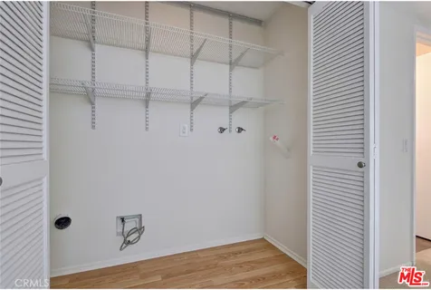 a view of a room with racks on the wall