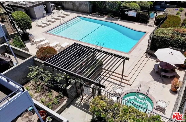 a view of a backyard with sitting area