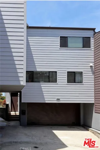 a front view of a house with stairs