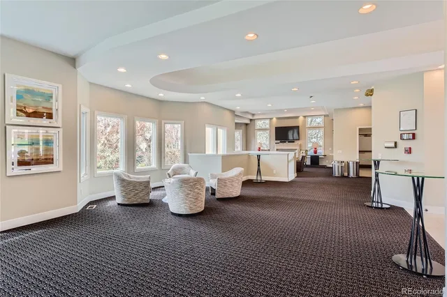 a view of a chairs and table in the backyard