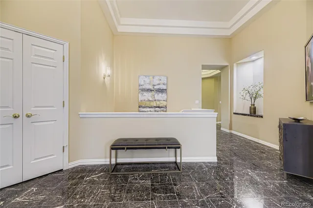 a view of a livingroom with furniture and a window