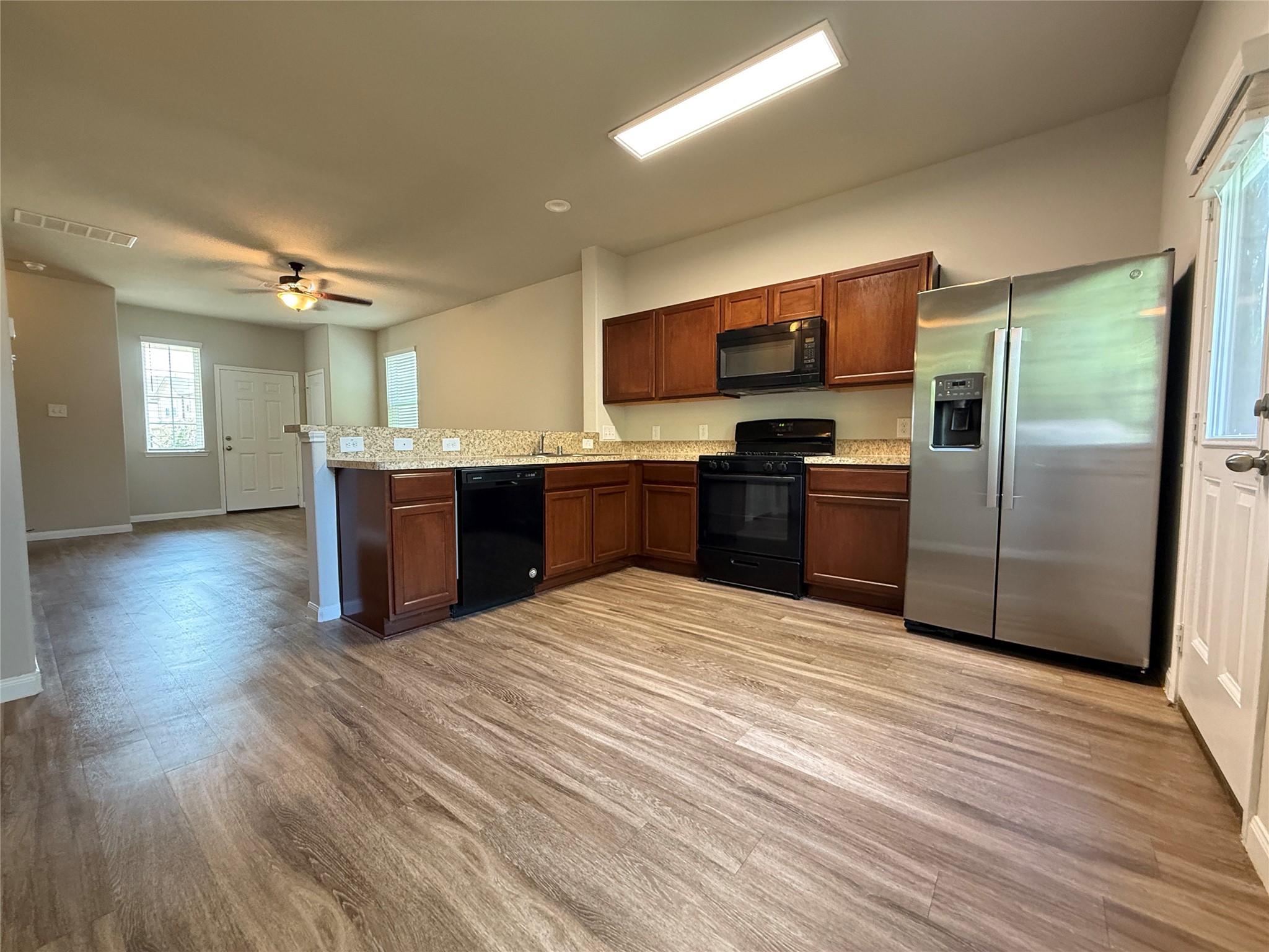 5842 Adelaide River Drive Katy, TX 77449 - Photo 11 of 40 a large kitchen with stainless steel appliances granite countertop a stove and a refrigerator