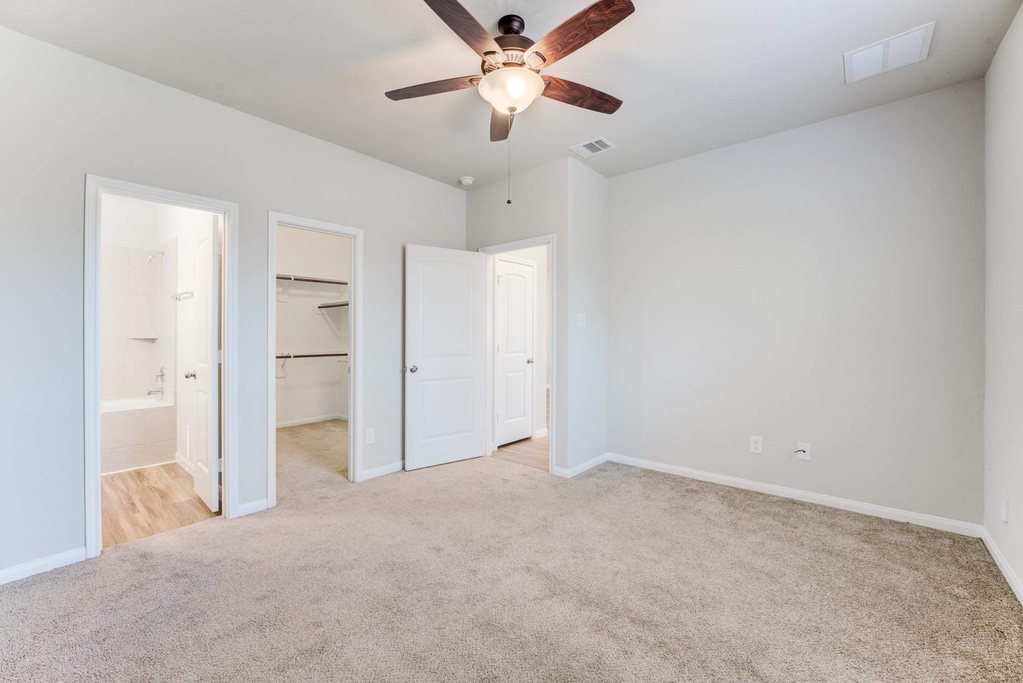 5842 Adelaide River Drive Katy, TX 77449 - Photo 17 of 40 an empty room with closet and a ceiling fan