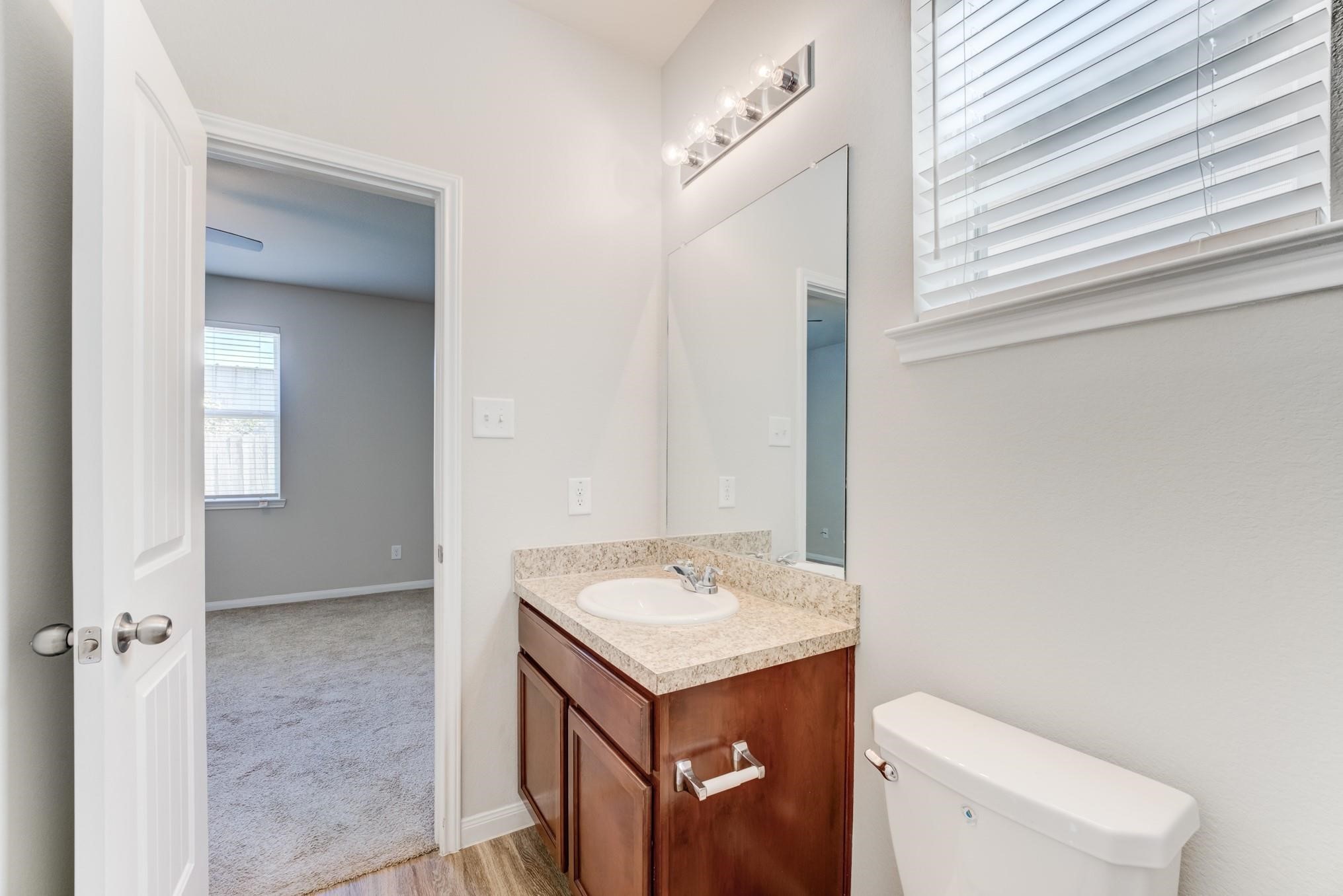 5842 Adelaide River Drive Katy, TX 77449 - Photo 21 of 40 a bathroom with a sink a toilet and shower