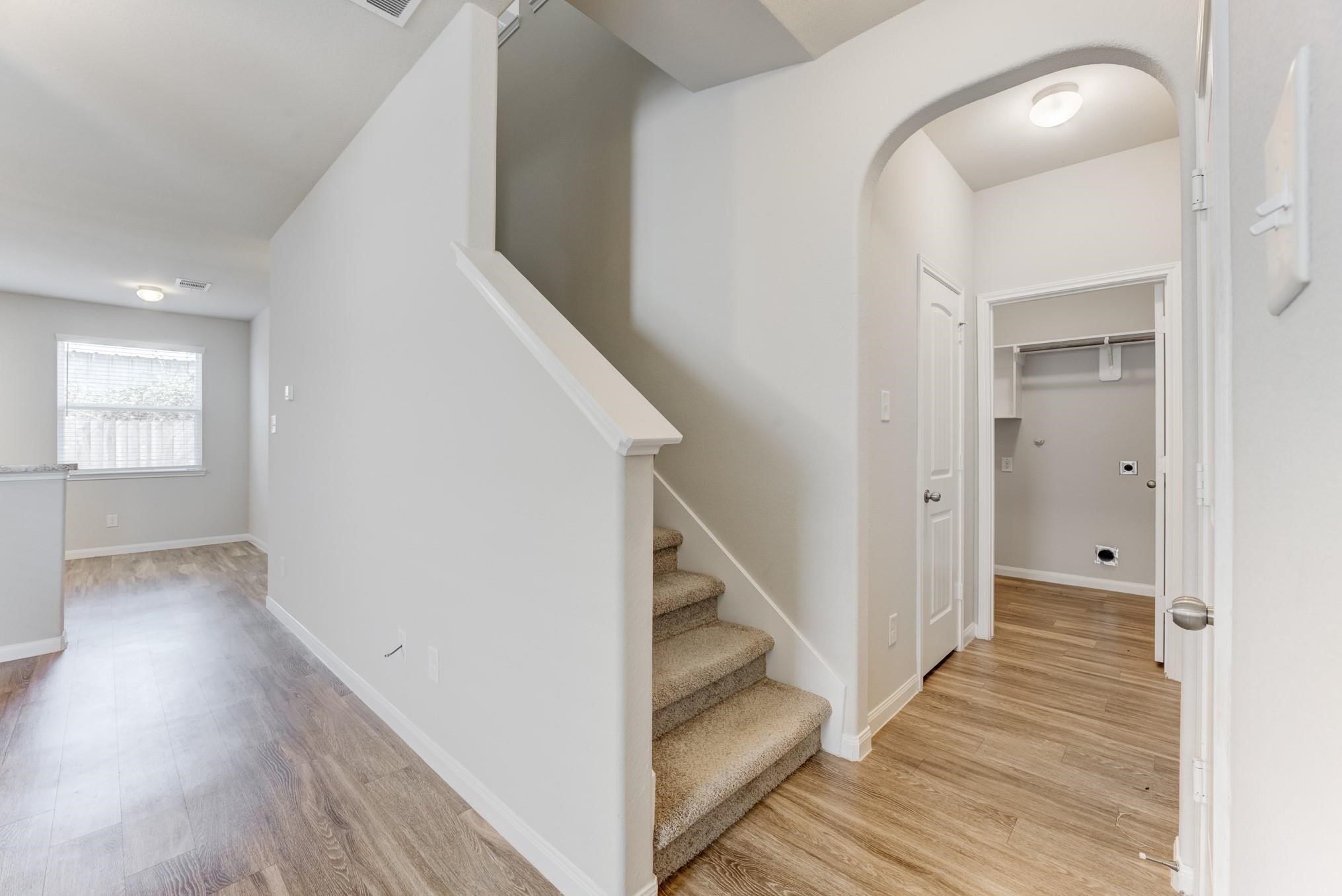 5842 Adelaide River Drive Katy, TX 77449 - Photo 22 of 40 a view of a hallway view with wooden floor and staircase