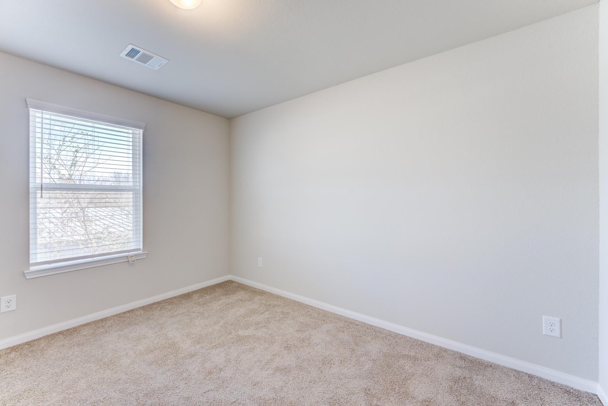 5842 Adelaide River Drive Katy, TX 77449 - Photo 26 of 40 an empty room with a window