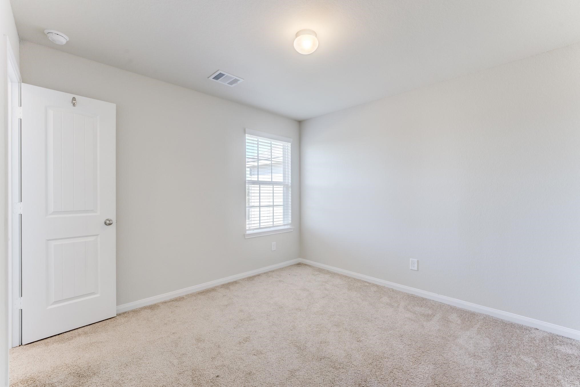 5842 Adelaide River Drive Katy, TX 77449 - Photo 31 of 40 a view of an empty room with a window