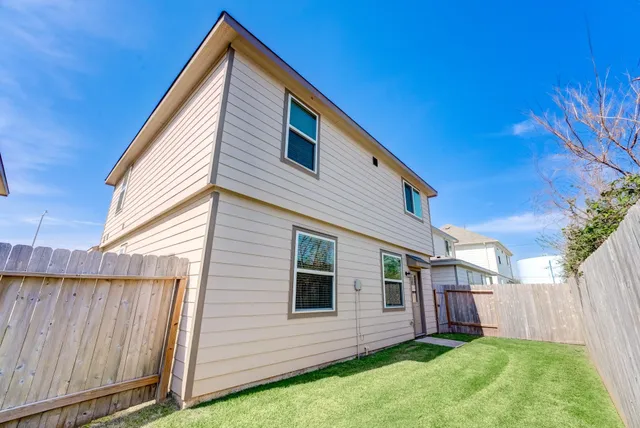 a view of backyard with a garden and deck