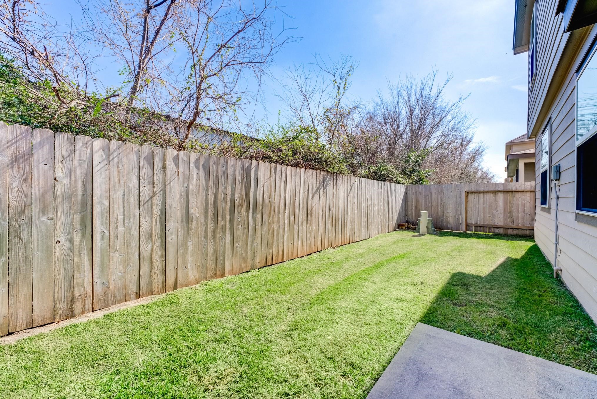 5842 Adelaide River Drive Katy, TX 77449 - Photo 39 of 40 a view of a backyard with a garden