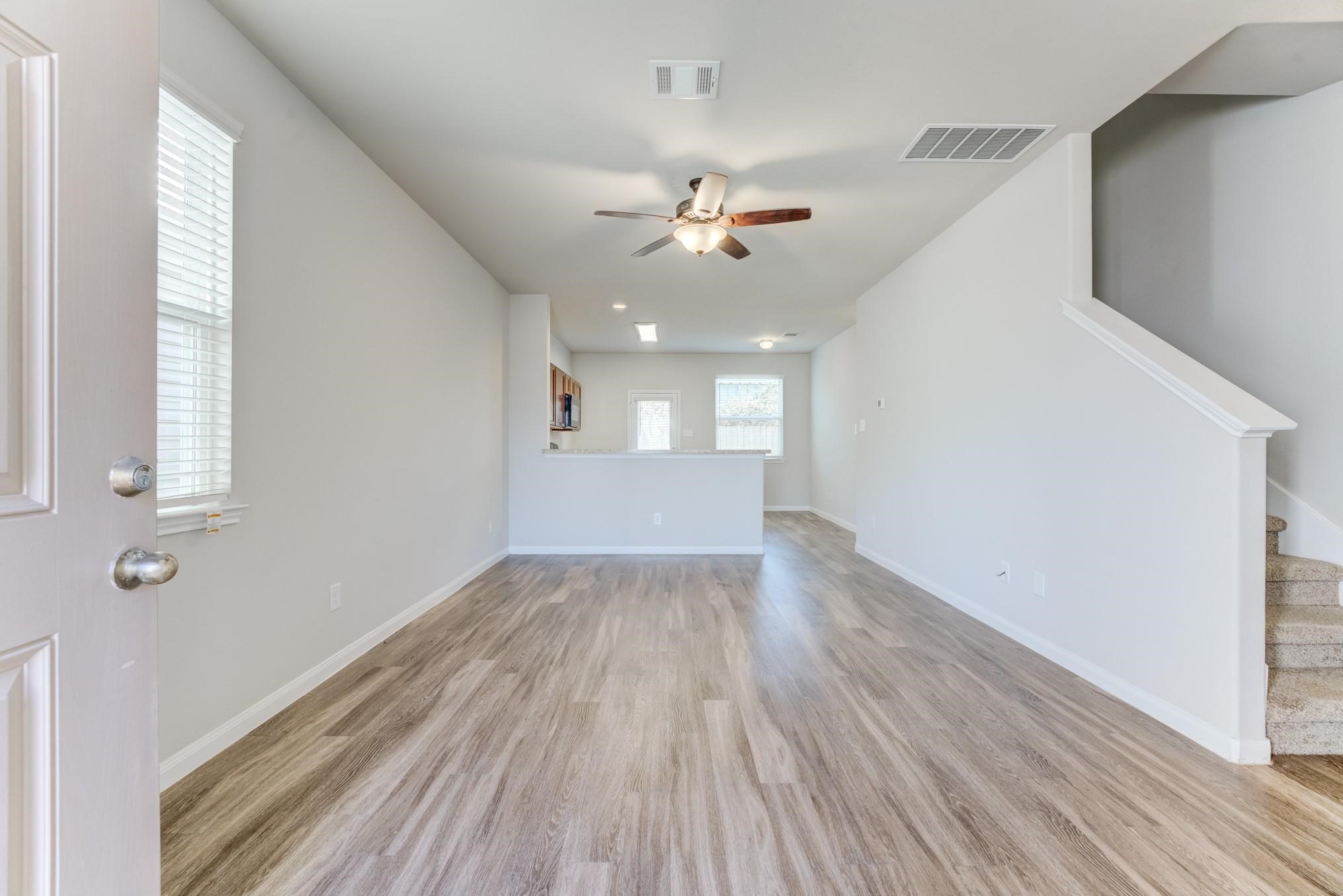 5842 Adelaide River Drive Katy, TX 77449 - Photo 4 of 40 wooden floor in an empty room with a window