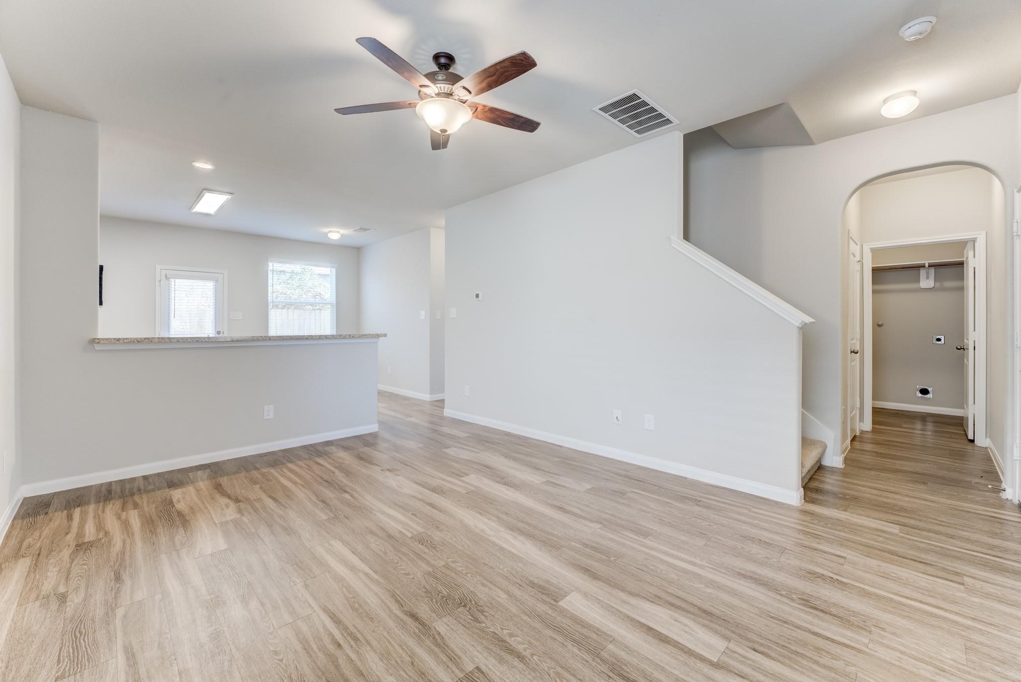 5842 Adelaide River Drive Katy, TX 77449 - Photo 6 of 40 an empty room with wooden floor and windows