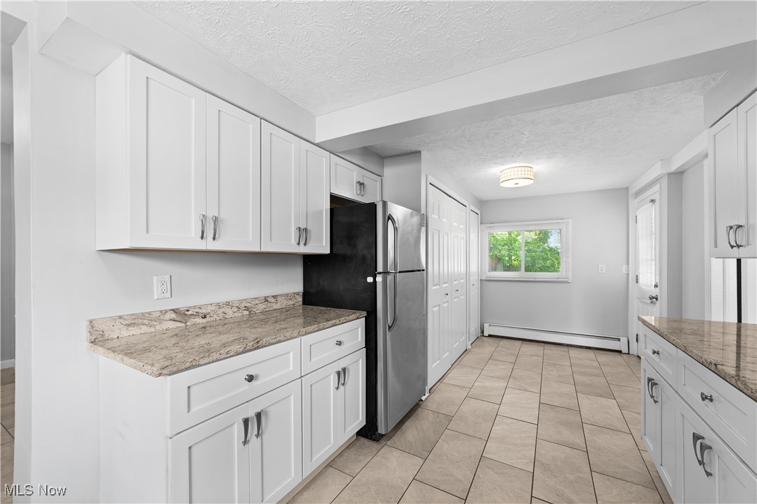 4920 Marigold Road Mentor, OH 44060 - Photo 20 of 34 Updated kitchen with granite counters, updated cabinets, ceramic flooring and appliances.