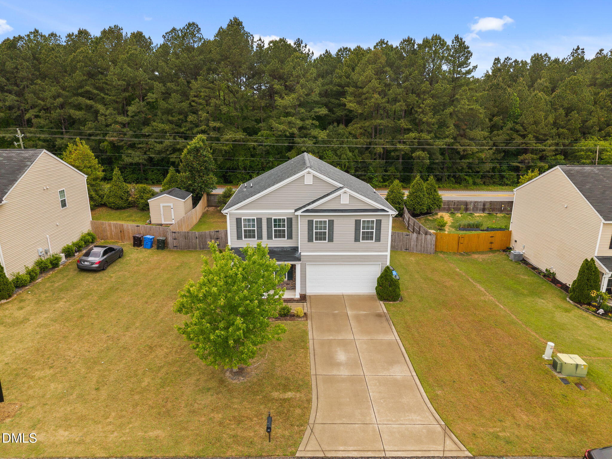 45 Crane Way Bunnlevel, NC 28323 - Photo 2 of 35 a view of a white house with a yard