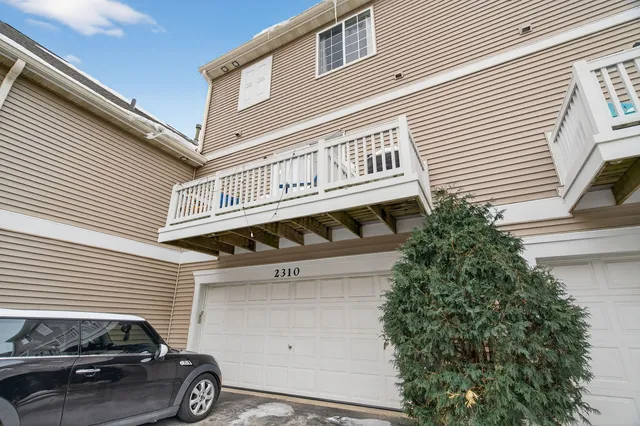 a front view of a building with parking space