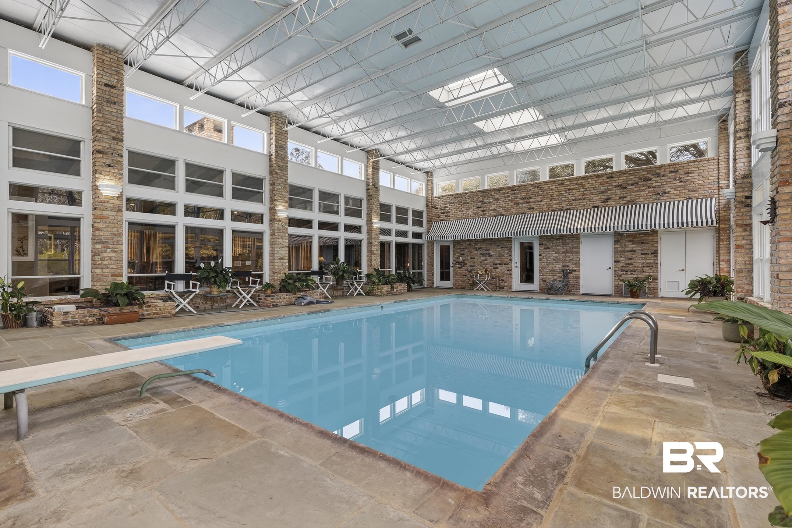 3175 Dawes Lake Road Mobile, AL 36619 - Photo 55 of 92 Indoor pool with a diving board and a patio area