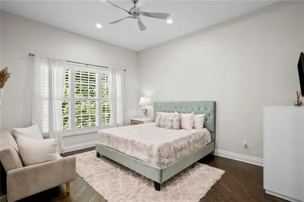a view of a patio with table and chairs with wooden floor and fence