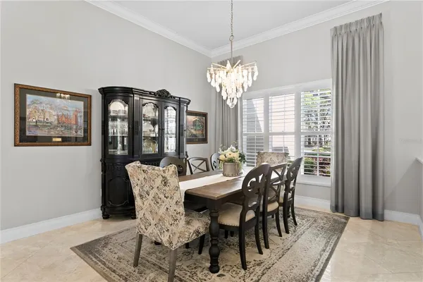 a living room with furniture a flat screen tv and a large window