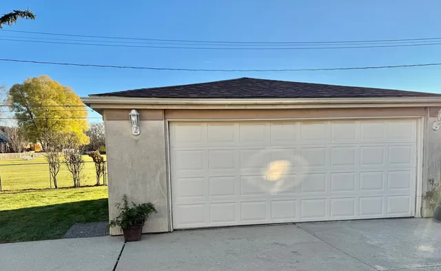 a kitchen with stainless steel appliances kitchen island granite countertop a sink and refrigerator