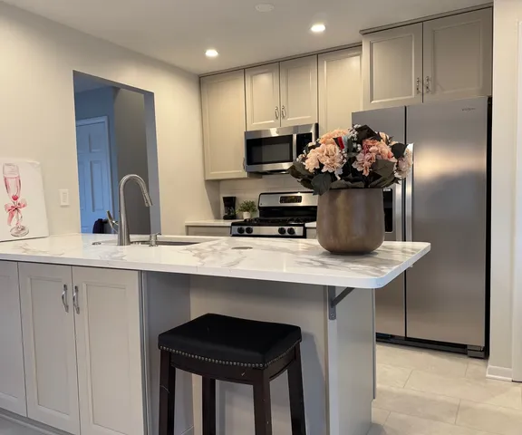 a bathroom with a sink mirror and toilet