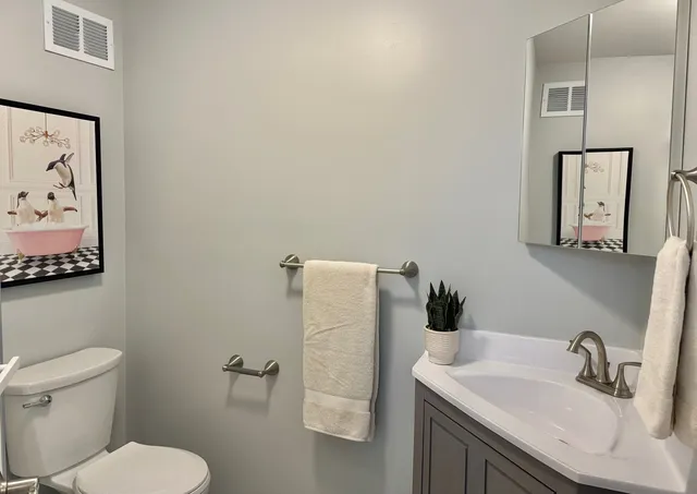 a room with a dresser and a window