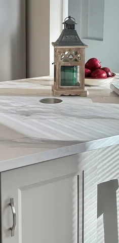 a bathroom with a granite countertop toilet a sink and bathtub