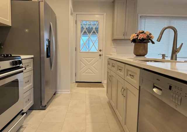 a view of a room with shelves and wooden floor